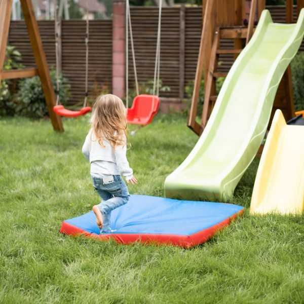 children ride from the children's slide, sisters play together in the garden, children play and have fun in the yard